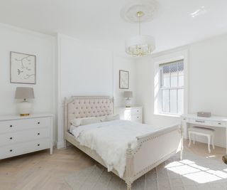 neutral bedroom with pale herringbone flooring