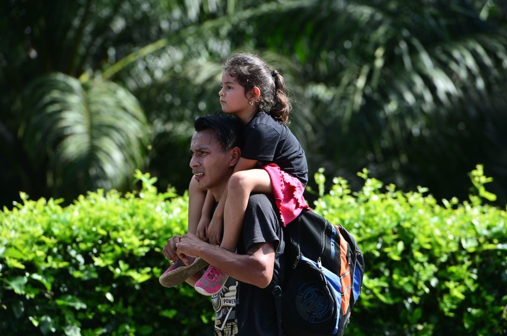 A migrant father and daughter.