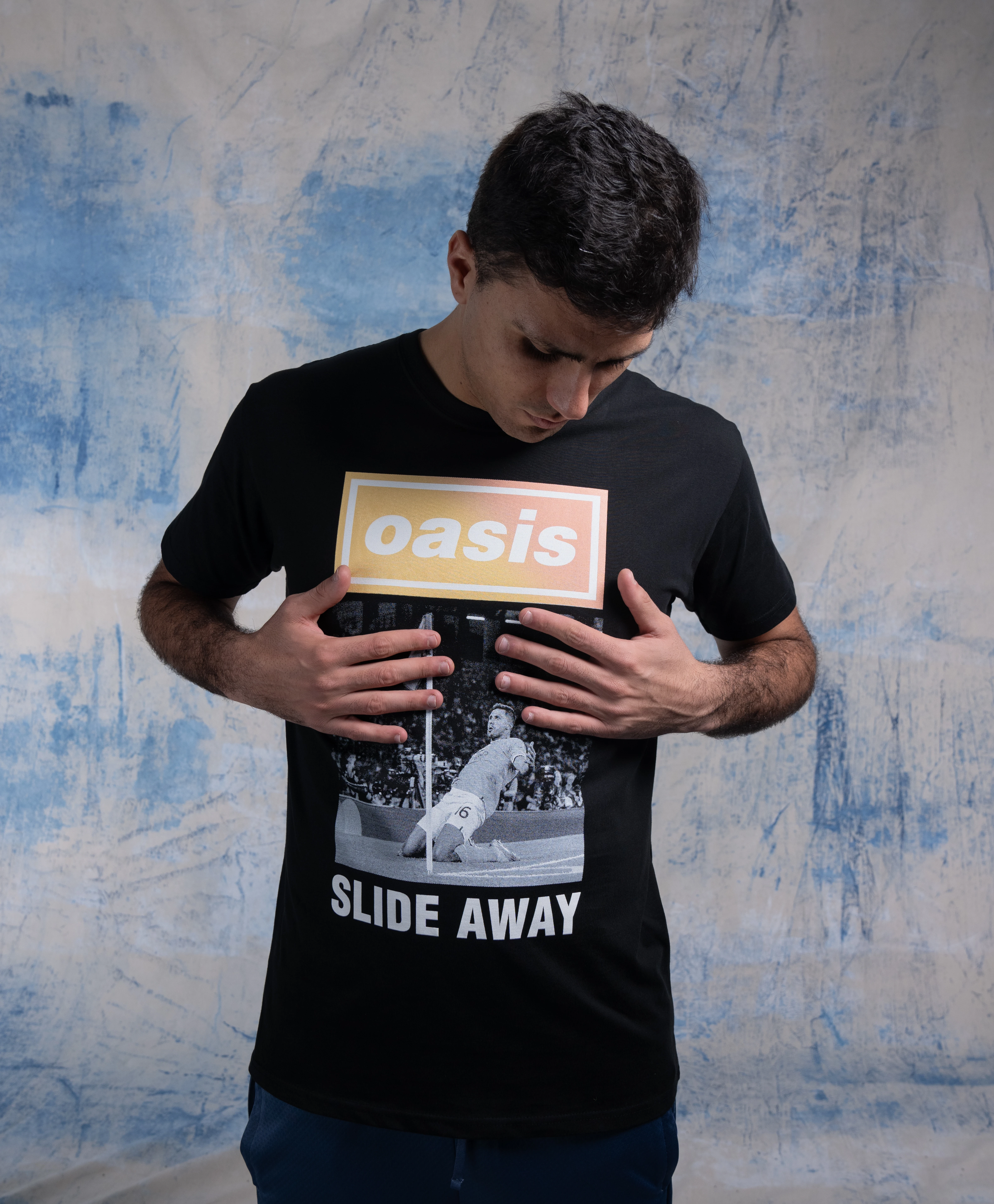 Rodri models the Manchester City x Oasis capsule collection