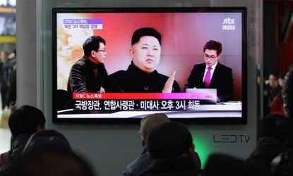 South Koreans watch a television broadcast reporting North Korea's nuclear test at the Seoul Railway station on Feb. 12. 