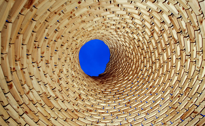 Looking out of the top of the wooden playhouse towards a blue sky