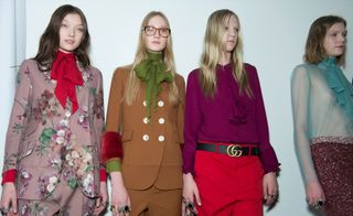 Female models wearing floral, red and brown clothes from the A/W 2015 collection