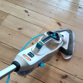 Vax Steam Fresh Combi S86-SF-C Steam Mop being used on a wooden floor