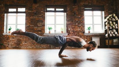 Man practices yoga