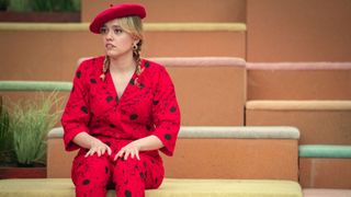 Aime Lou Wood as Aimee Gibbs in a red patterned jumpsuit and matching beret in Sex Education season 4 episode 7
