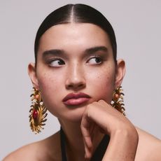 A model wearing a '90s makeup look