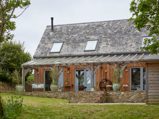 Exterior of the house with veranda and garden in shot