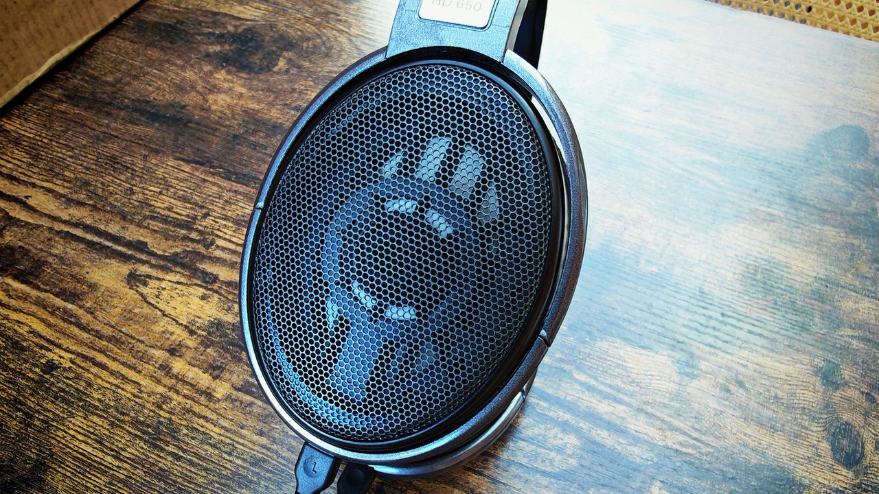 Photos featuring the Bose QC Ultras and the Sennheiser HD 650s.