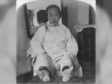 A high caste lady's feet were bound to form the "lotus shape," in China around 1900.