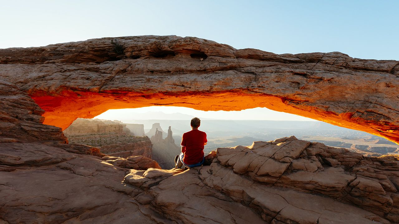 A man sitting on a mountaintop