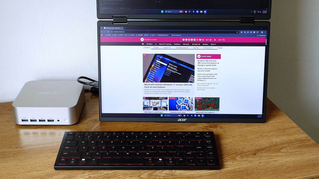 Acer's dual-screen portable monitor connected to a Geekom A9 Max showing the Windows Central homepage.