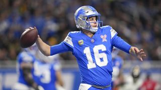 Jared Goff of the Detroit Lions looks to make a pass during an NFL football game.