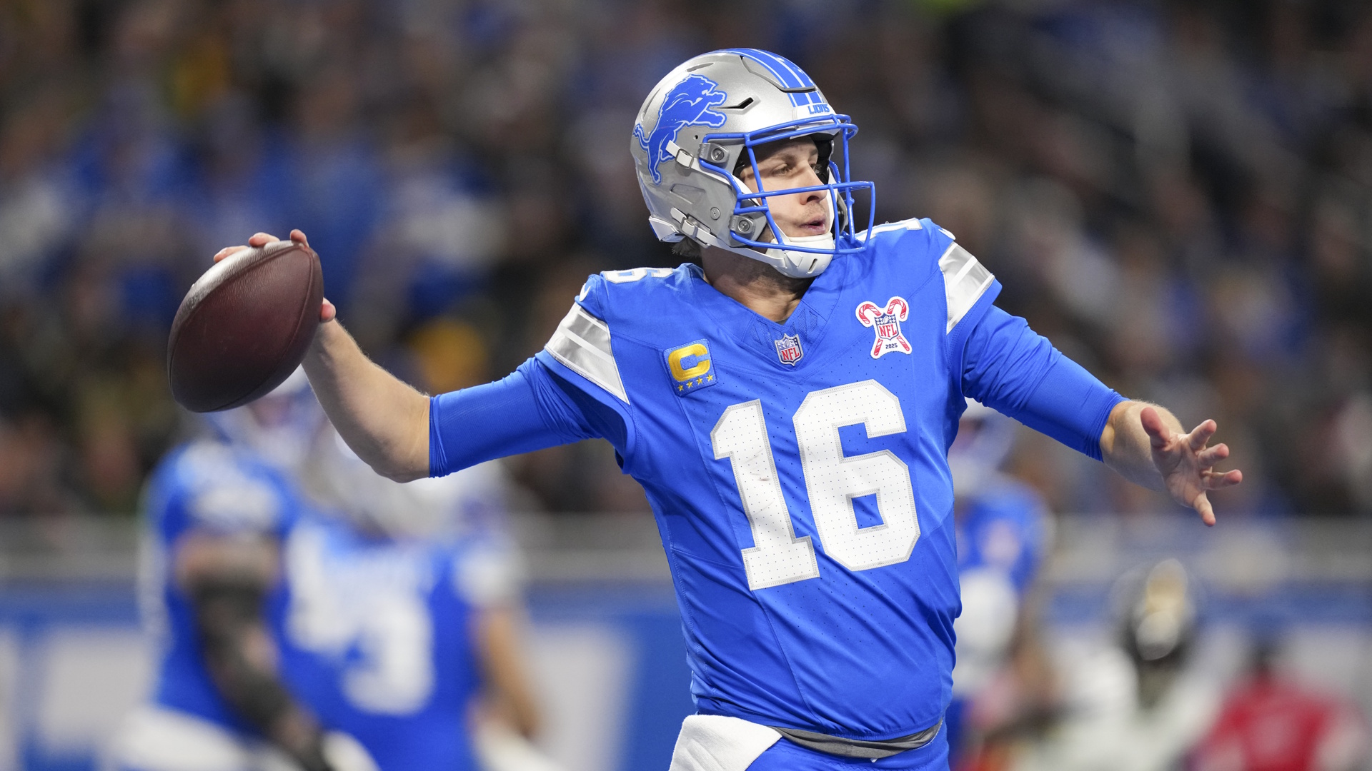 Jared Goff of the Detroit Lions looks to make a pass during an NFL football game.