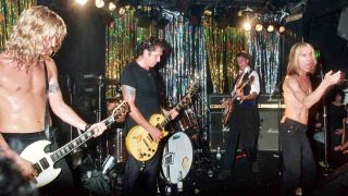 Duff McKagan performing onstage with Steve Jones, Duran Duran’s John Taylor and Iggy Pop as the Neurotic Outsiders