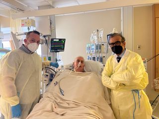 David Bennett Sr. (center) after his groundbreaking heart transplant. Bennett is pictured with his son, David Bennett Jr (left), and Dr. Muhammad Mohiuddin, director of the Cardiac Xenotransplantation Program at the University of Maryland Medical Center.