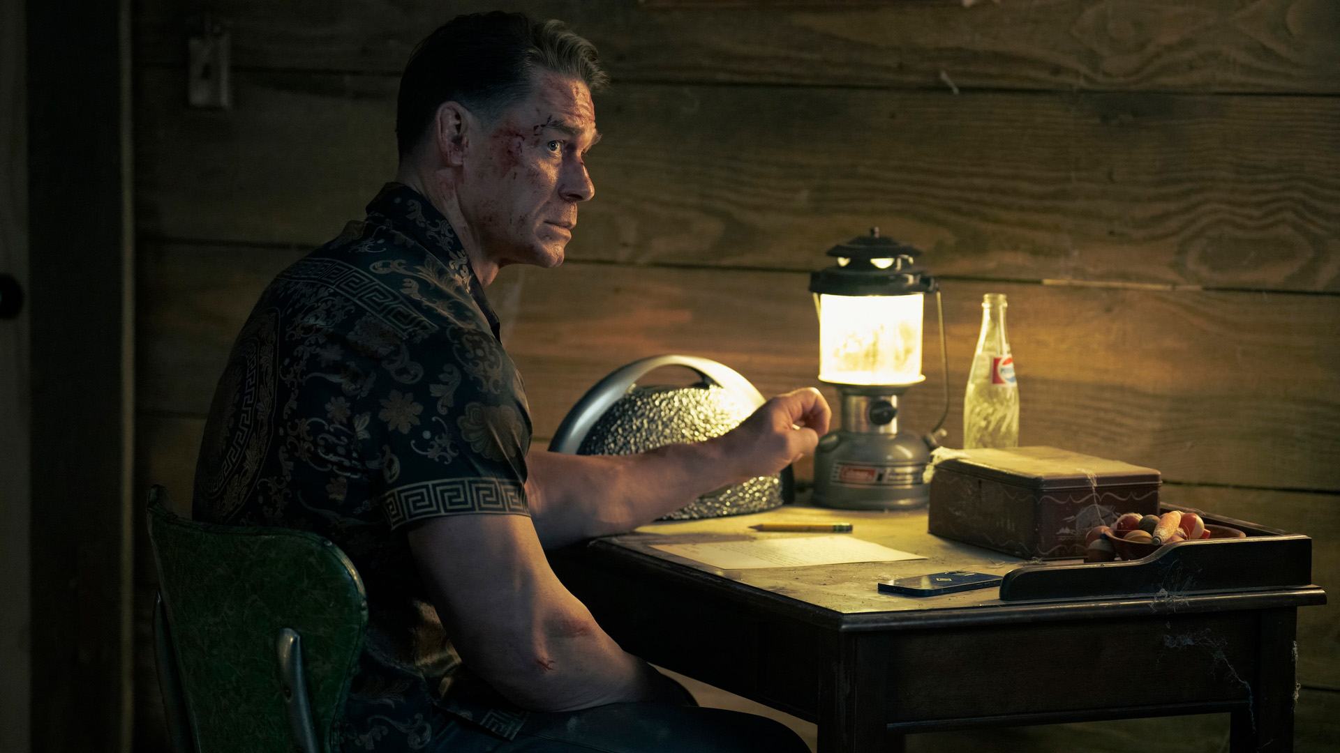 John Cena as a pensive Peacemaker in Peacemaker season 2.