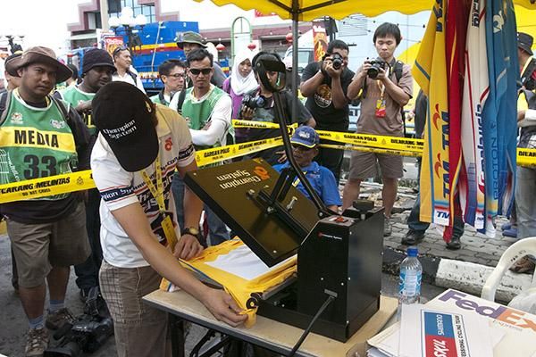 Another yellow jersey is prepared at the press in Sitiawan after the finish to stage three.