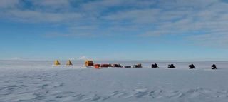 The installation of the seismograph network is part of a project called Polenet. Here, traveling researchers have set up camp for the night. The camp faces north toward Mount Waesche, left, and Mount Sidley, in the middle.