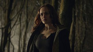 Lina (Rose Williams) in the woods at night in Locked In