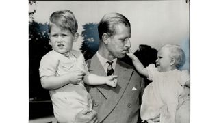 Prince Philip young - CANADA - JANUARY 27: The Happy Father Prince Phillip will have another baby to bounce in his arms now that Charles and Anne; seen with him here are a trifle big for that. He may be a nervous expectant dad but Queen appears philisophical. Her recent comment childbirth was: It (Photo by Norman James/Toronto Star via Getty Images)