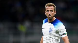 Harry Kane in action for England against Italy and wearing the One Love armband.