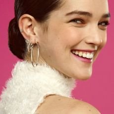 Model wearing H Samuel earrings