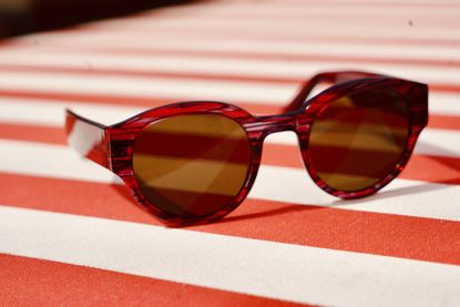 SMR Days Prism Sunglasses on striped tablecloth