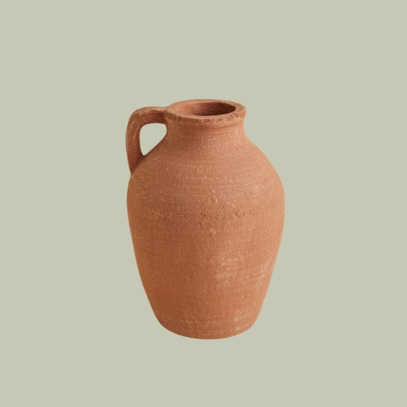 Agnon Terracotta Vase with Handle Agnon against pale green background.