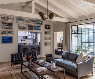 living room with view to kitchen and gallery wall