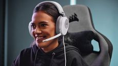 Corsair HS65 Surround review: woman wearing gaming headset