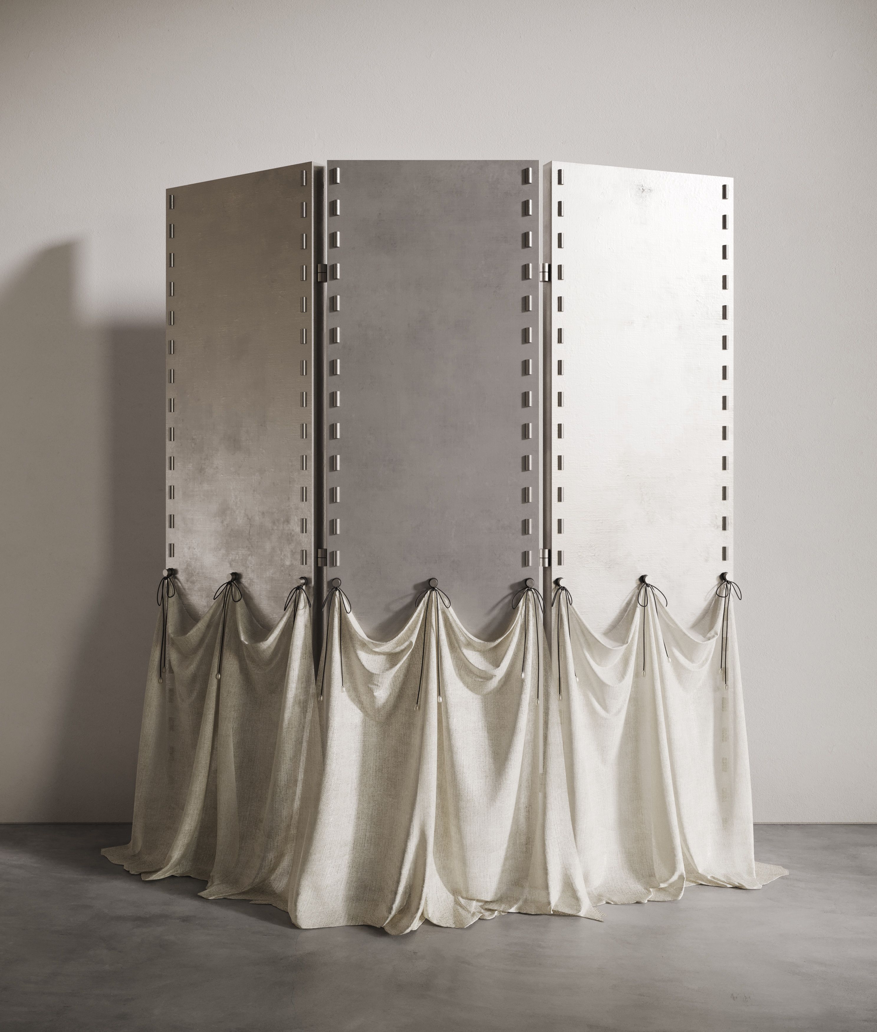 A standing separee in brushed chrome with attached white 'skirt' on its lower end.