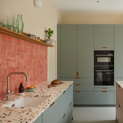 Blue and terrazzo plykea kitchen with pink tiles