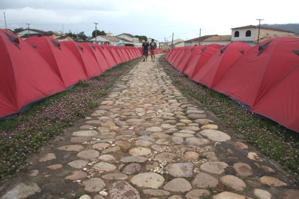 A cobbled road through tent city.