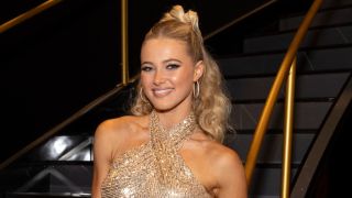 Rylee Arnold in a gold top on Dancing with the Stars. 