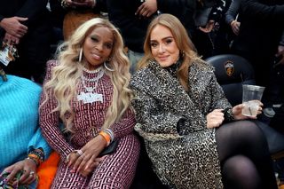 Mary J. Blige and Adele attend the 2022 NBA All-Star Game at Rocket Mortgage Fieldhouse on February 20, 2022 in Cleveland, Ohio