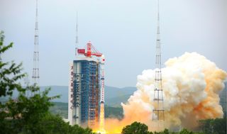 A Chinese Long March 4B rocket lifts off from Taiyuan Satellite Launch Center in the province of Shanxi . The rocket carried the Ziyuan III 03 Earth-mapping satellite and two other satellites to hunt dark matter and collect data.