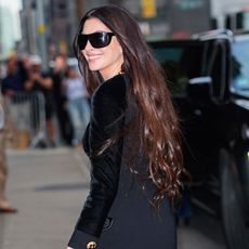 Anne Hathaway wears black sunglasses