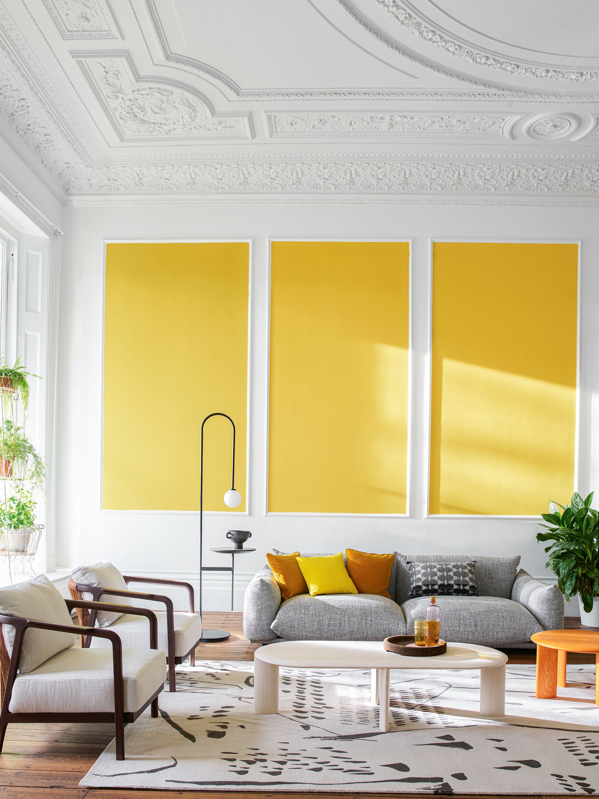 Grey and yellow living room with panelling
