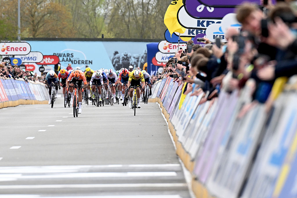 WAREGEM, BELGIUM - APRIL 01: (L-R) Race winner Filippo Ganna of Italy and Team INEOS Grenadiers and Wout van Aert of Belgium and Team Visma | Lease a Bike sprint at finish line during the 80th Dwars Door Vlaanderen 2026 - Men&amp;amp;apos;s Elite a 184.6km one day race from Roeselare to Waregem / #UCIWT / on April 01, 2026 in Waregem, Belgium. (Photo by Dario Belingheri/Getty Images)