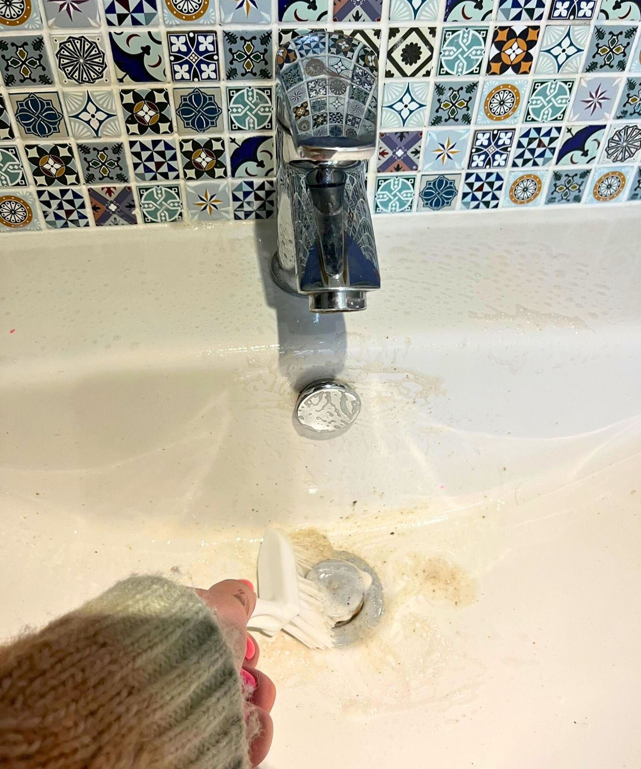 Lots of dirt coming out of sink drain after using a scrubbing brush
