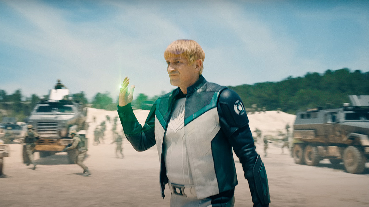 Guy Gardner activating his Green Lantern ring in a desert area in Superman