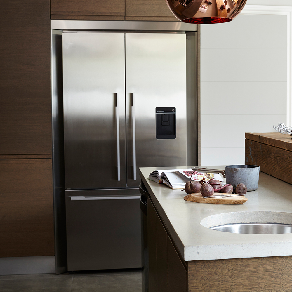 American fridge freezer in a kitchen with beetroot on the sideboard