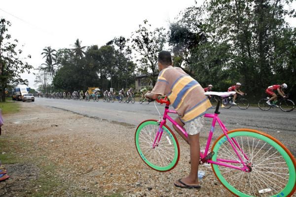 A local boy shows his support by coming out to watch the race