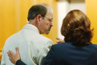 Dennis Rader consults with his lawyer, Sarah McKinnon, while entering his guilty pleas before Judge Gregory on June 27, 2005, admitting his guilt in 10 murders in the Wichita area
