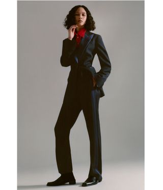 woman with black shoe and suit