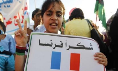 A Libyan girl rallies in Benghazi last week: Rebels are gaining momentum against Moammar Gadhafi, after Turkey formally recognized the rebel Transitional National Council. 