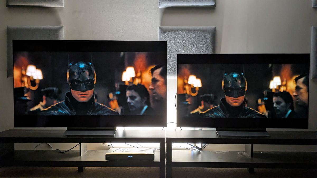 LG C6 (left) and LG C5 (right) OLED TVs showing Batman walking down a dim hallway. Both TVs again have strong contrast but the C6's is more refined with punchier lights and better shadow detail