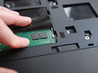 Press down on the RAM module until it clicks into place