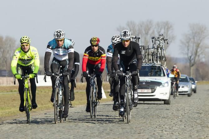 Belgian champion Tom Boonen (Omega Pharma-Quick Step) rolls along with his teammates on a sector of cobbles.