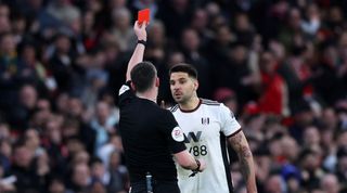 Aleksandar Mitrovic is shown a red card by Chris Kavanagh during Fulham's 3-1 loss to Manchester United